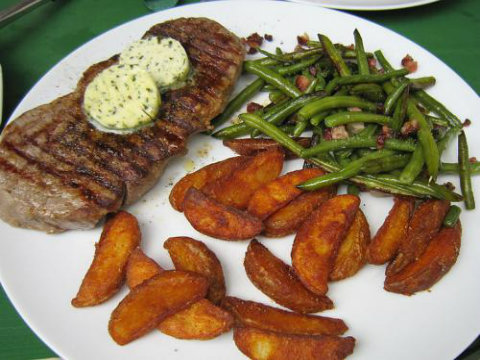 Grilled Porterhouse Steaks with Lemon and Chive Butter Grilled Porterhouse Steaks with Lemon and Chive Butter picture