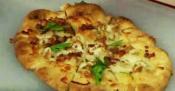 A pair Of Gourmet Pizzas