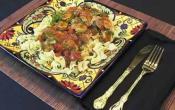 Puerto Rican Chicken in spicy tomato Sauce Over Noodles