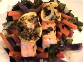 Salmon In Parchment On A Bed Of Greens With Julienne Root Vegetables