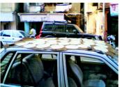 Drying Papad On A Car Roof