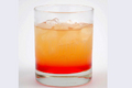 Dragon Slayer Cocktail with a Mix of Orange and Grenadine