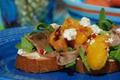 How To Make Grilled Peach, Prosciutto & Crostini Salad