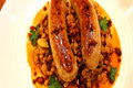 Italian Sausages with Braised Lentils and Crispy Chorizo 