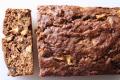 Loaf Of Banana Date Bread With A Slice