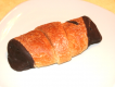 Nut-nougat Filled Croissant With Chocolate At The Side