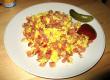 Sliced Fried Sausage With Eggs, Ketchup, Pickled Cucumber