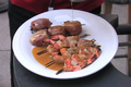 Plank Grilled Salmon Shrimp and Scallops Wrapped in Prosciutto 