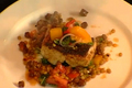 How To Make Wild Striped Bass With Braised Greens And Tomato Confit