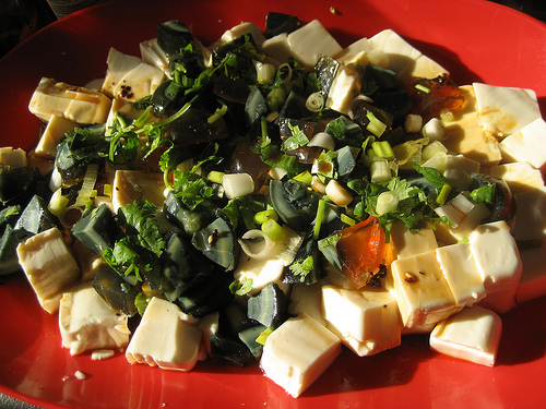 Chilled Tofu, topped with Century Egg chunks and chopped spring onion. Chilled Tofu, topped with Century Egg chunks and chopped spring onion.