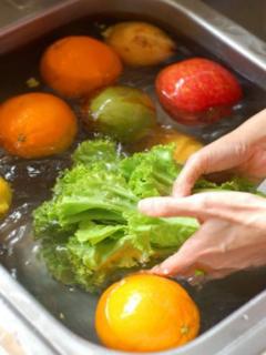 Put all the vegetables in the sink and fill it with water for cleaning