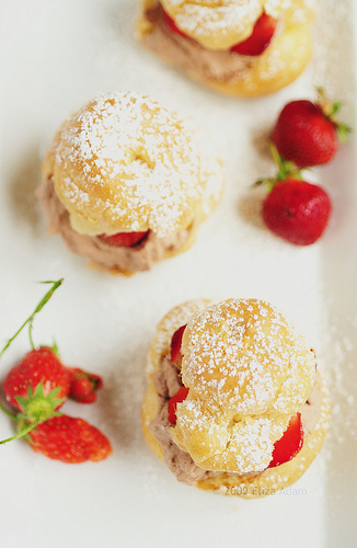 Mocha Cream Puffs served with Fresh Strawberries. Mocha Cream Puffs served with Fresh Strawberries.