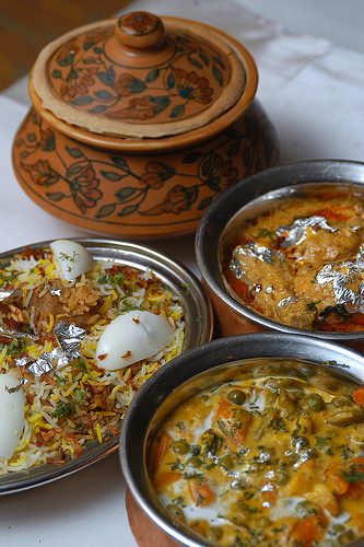 A bowl of Hyderabadi Biryani served with boiled egg as is the norm in Indian Restaurants. A bowl of Hyderabadi Biryani served with boiled egg as is the norm in Indian Restaurants.