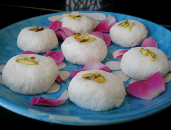 Sandesh mishti garnished with rose petals.