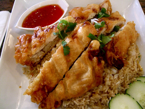 Khao Phat Kai topped with fried chicken Khao Phat Kai topped with fried chicken
