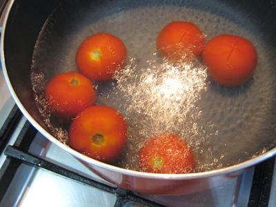 Tomatoes boiling in the process of preserving them