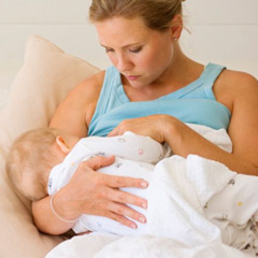 Mother breast feeding her baby