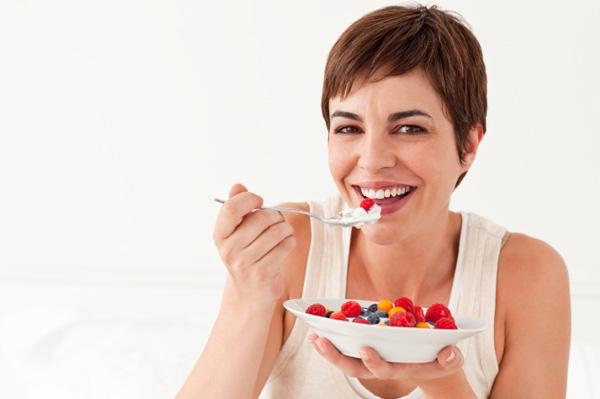 woman eating yogurt