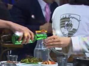 Hold your glass with both your hands when accepting a drink