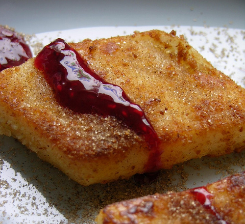 Leche Frita may be topped up sugar, cinnamon, fruit jam, lemon zest, caramel, or vanilla liqueur