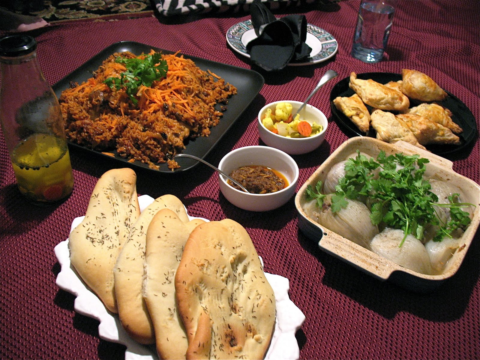 A traditional Afghan Table spread or Dastarkhan, with Osh Pyozee served at bottom right