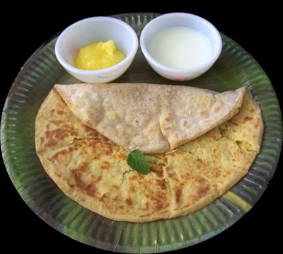 Puran poli is traditionally eaten with milk and ghee