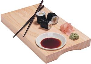 A typical Sushi spread out with sushi, sashimi, shoyu dish, and a dollop of wasabi paste