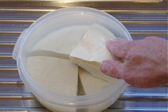 Tofu being stored in an air tight container 
