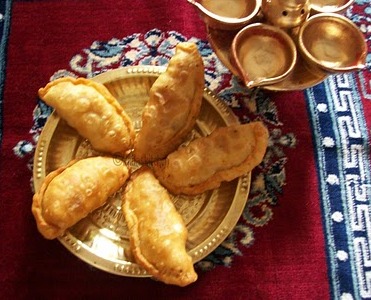 Assorted Karanjias for Diwali - Sweet Stuffed Fried Dumplings Assorted Karanjias for Diwali - Sweet Stuffed Fried Dumplings picture