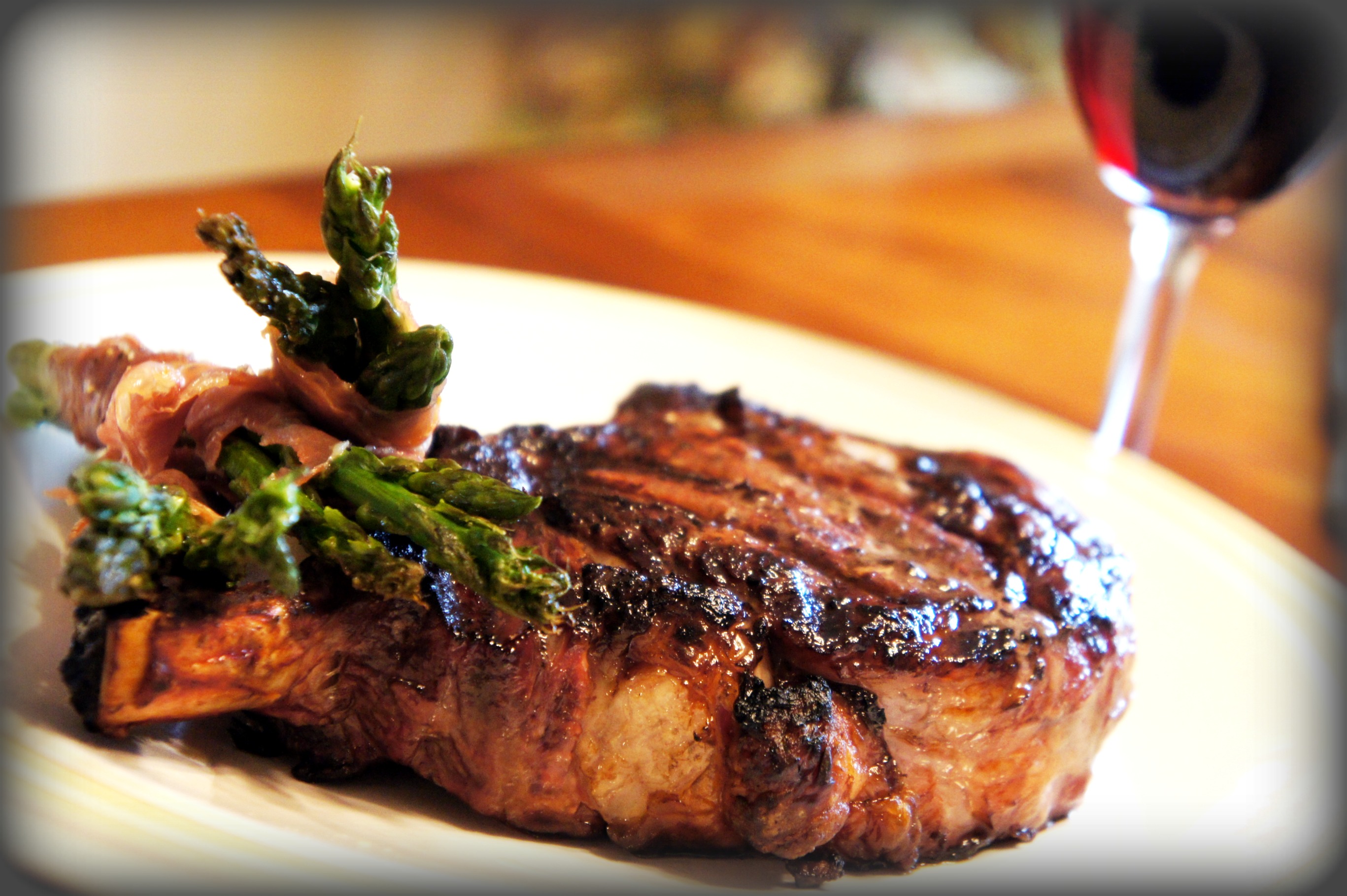 Marinated Grilled Steak with Prosciutto wrapped Asparagus Marinated Grilled Steak with Prosciutto wrapped Asparagus picture