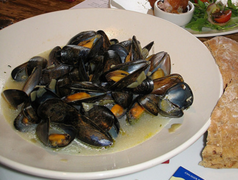 Steamed Mediterranean Mussels with Cinnamon Basil Ouzo and Feta Cheese Steamed Mediterranean Mussels with Cinnamon Basil Ouzo and Feta Cheese picture